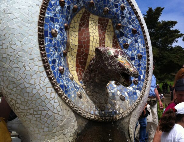 Park Guell. Medalion with the Catalan shield and the misterious snake at the fountain Designed by Antoni Gaudi.